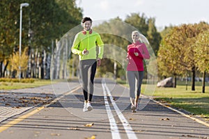 Sport Concepts. City Running Couple Happily Jogging Outside as Runners Training Outdoors Working Out in City As Fitness Couple