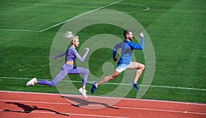 sport couple team in sportswear running on stadium, stamina