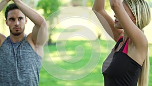 Sport couple training yoga prayer at outdoor workout. Young man and woman