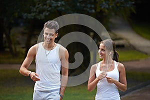 Sport couple walking in the summer park