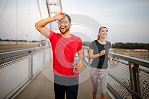 Sport couple. Young man and woman jogging outdoor