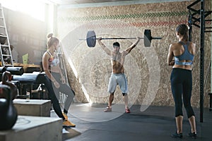 Sport. Crossfit Athletes At Workout Gym