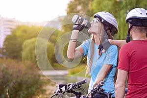 Sport and cycling Concept: Young Caucasian Cyclist Resting Toget