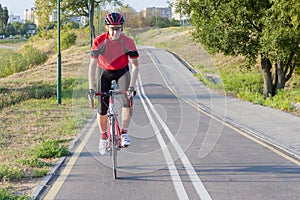 Sport and Cycling Ideas. Portrait of Professional Male Cyclist