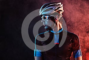 Sport. Cyclist carry a bike on dramatic background.