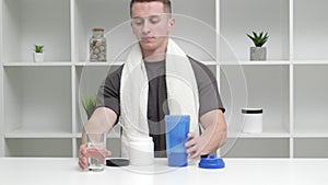 Sport eating concept. Strong man makes a protein shake after a workout