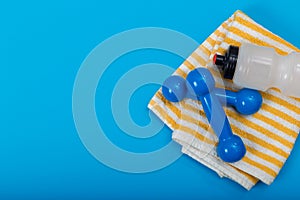 Sport equipment on blue background, top view. Concept healthy lifestyle, sport and diet