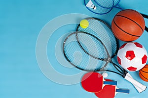 Sport equipment flat lay. Variety of rackets and balls