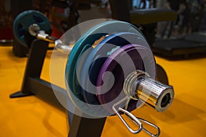 Sport equipment in gym. close-up view of a barbells on a stand in the sports hall
