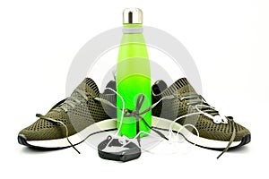 Sport equipment. New green Sport shoes on white background