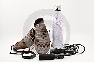 Sport equipment. Skipping rope sport shoes, water bottle, smart watch