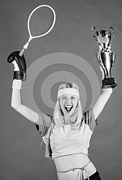 Sport equipment store. Sport shop assortment. Girl cheerful successful modern woman hold golden goblet of sport champion