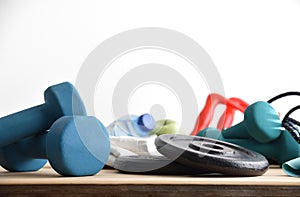 Sport equipment on wooden table white isolated background