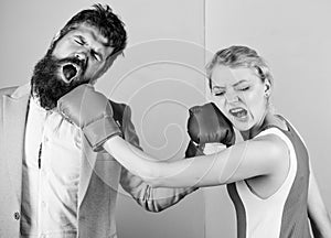 Sport for everyone. family couple boxing gloves. bearded man hipster fighting with woman. knockout punching. who is