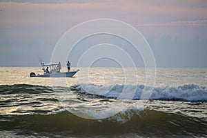 Sport fishing just off the Florida coast at sunrise.