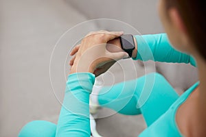Sport. Fitness Girl Checks Tracker On Wrist Before Workout. Fashion Sporty Woman.