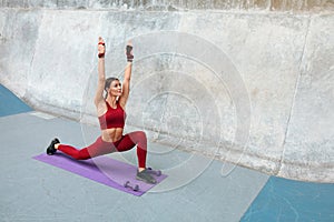 Sport. Fitness Girl Doing Stretching Workout On Yoga Mat. Fashion Sporty Woman With Strong Muscular Body.