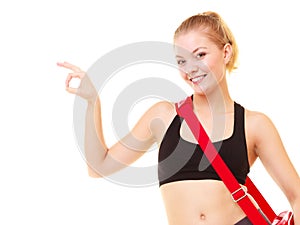 Sport. Fitness girl with gym bag showing ok hand sign