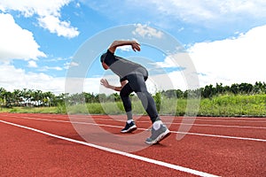 Sport and fitness runner man running on racetrack training