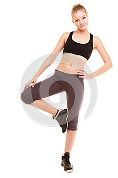 Sport. fitness sporty blonde girl stretching leg isolated