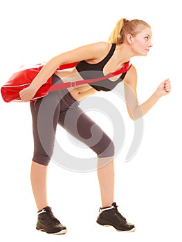 Sport. Fitness sporty girl with gym bag running to training