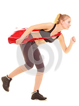 Sport. Fitness sporty girl with gym bag running to training