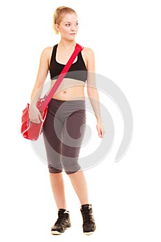 Sport. Fitness sporty girl in sportswear with gym bag