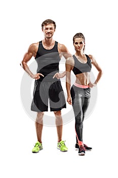 Sport, fitness, workout concept. Fit couple, strong muscular man and slim woman posing on a white background