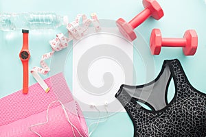 Sport, Fitness and Yoga equipments with sport bra and white blank paper, Healthy lifestyle concept