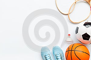 Sport games background - basketball, soccer ball, rackets, sneakers. Copy space