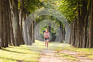 Sport girl making exercises outdoors.