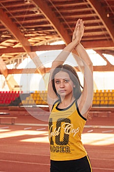 Sport girl in track and field athletics playpen