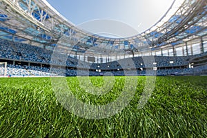 Sport grass field stadium on a sunny day blue sky.