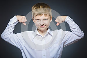 Sport Handsome Boy. Strong serious kid showing his hand biceps muscles