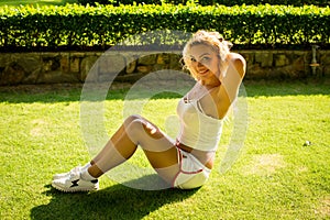 Sport and lifestyle concept - woman doing sports outdoors