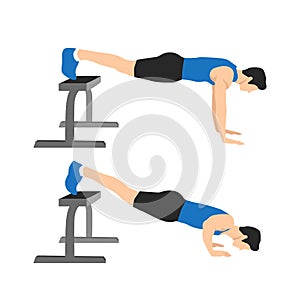 Sport man do the Decline push ups with Feet on bench for exercise