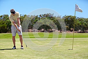 Sport, man and golf on grass outdoor for playing, performance and game with fitness and wellness. Athlete, mature person