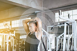 Sport man stretching for warming up befor doing exercises training,Cross fit body muscular workout in the gym