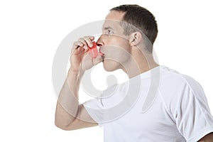 Sport man using a asthma pump