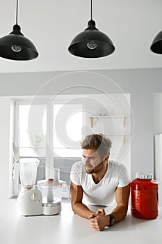 Sport Nutrition. Healthy Man Going To Prepare Shake In Kitchen