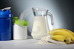 Sport Nutrition Supplement containers with jug of milk