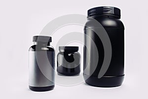 Sport Nutrition, Whey Protein and Gainer. Black Plastic Jars iso