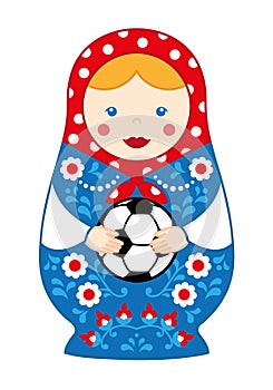Russian cute traditional toy nesting doll girl matroshka with football. photo