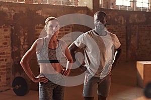 Sport people after exercising at gym portrait. Fitness couple