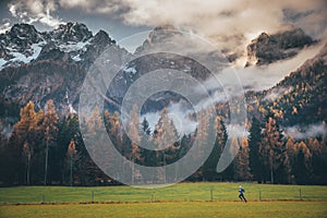 Sport photo, active life in outdoor. Man train in autumn mountains. Alps, Italy