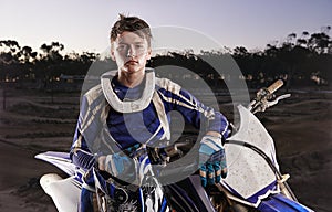 Sport, portrait and man with off road motorbike, confidence and gear for competition, race or challenge. Adventure