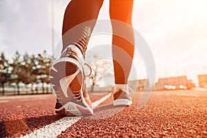 Sport run female training. Run girl workout exercise. Runner feet running on road closeup on shoe. Fitness, sport