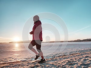 Sport running fitness woman jogging on beach run. Female athlete runne