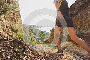 Sport running man in cross country trail run