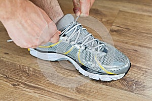 Sport shoe tying, exercise at gym